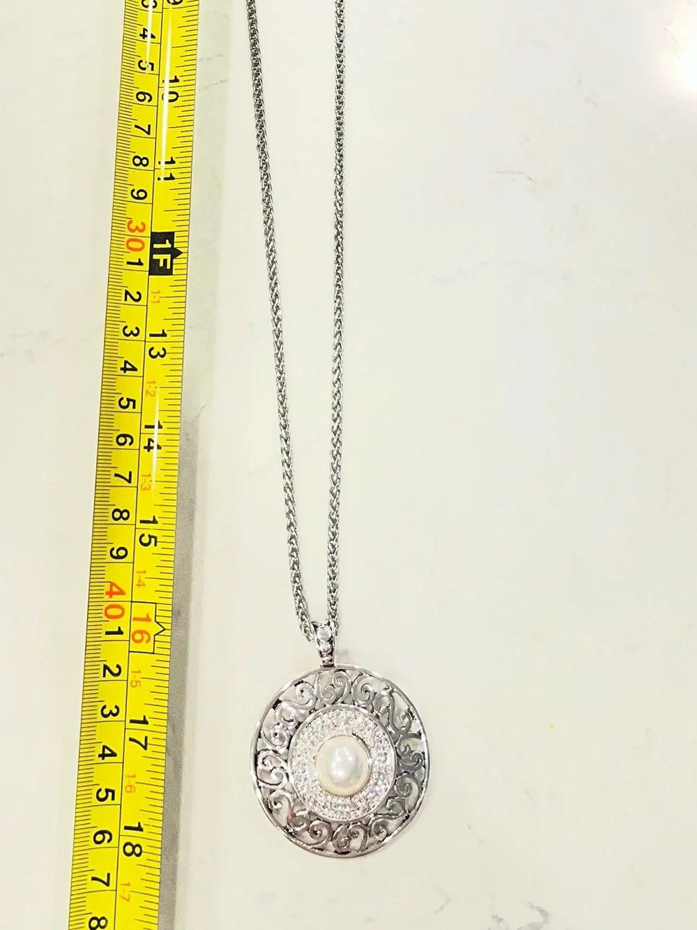 Silver tone faux pearl pendant necklace